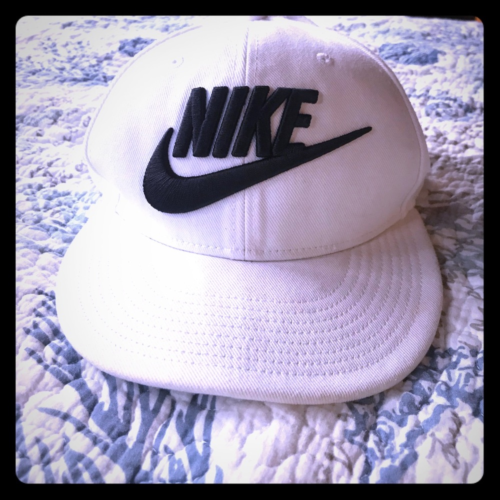 Nike white hat.